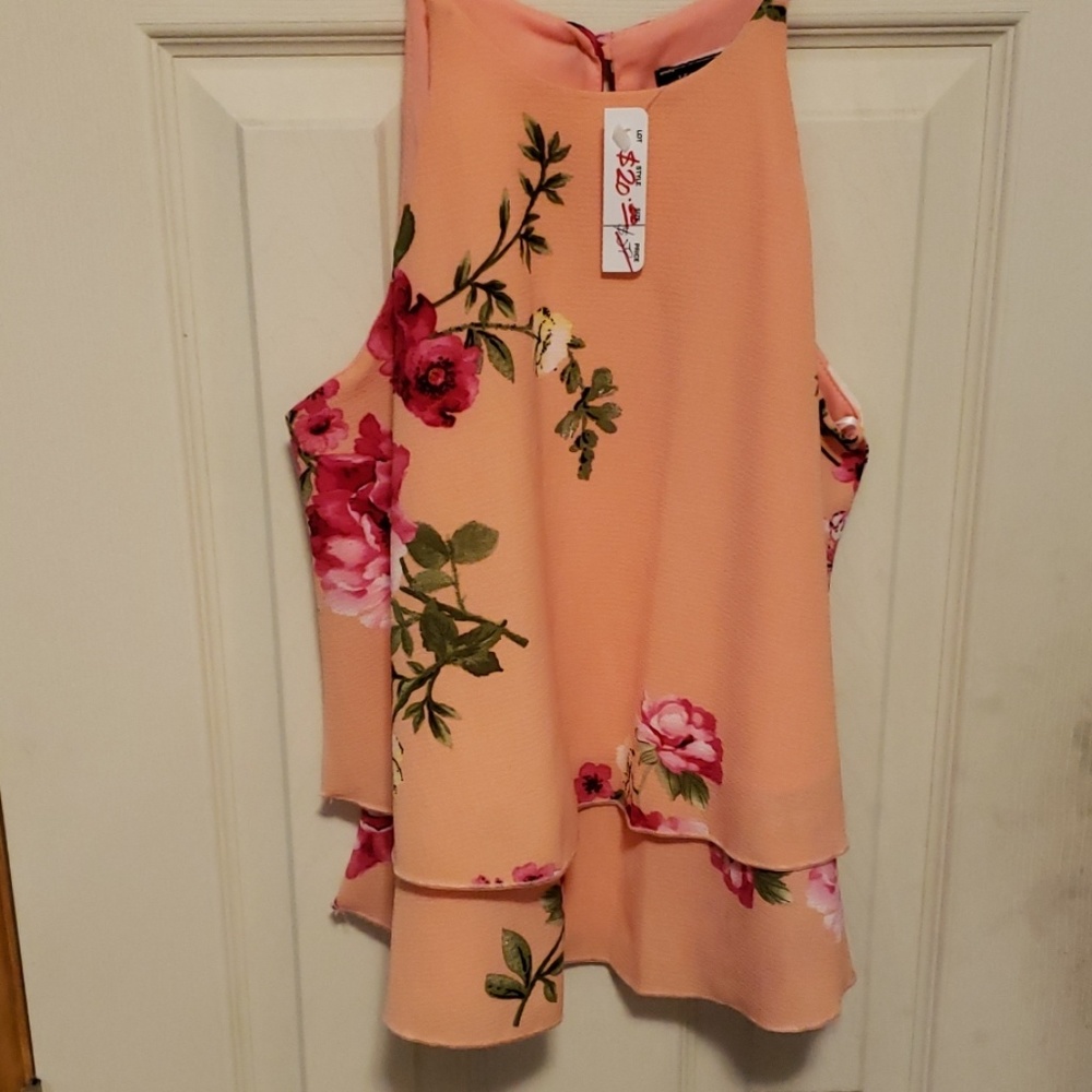 Peach top with dark pink floral print.